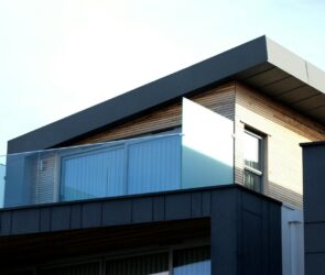 Contemporary building facade with sleek lines and glass elements in Poole, UK.