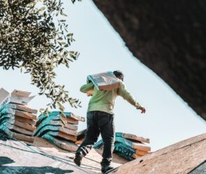 a man riding a skateboard on top of a roof