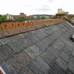 a side of a roof with shingles