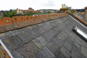 a side of a roof with shingles