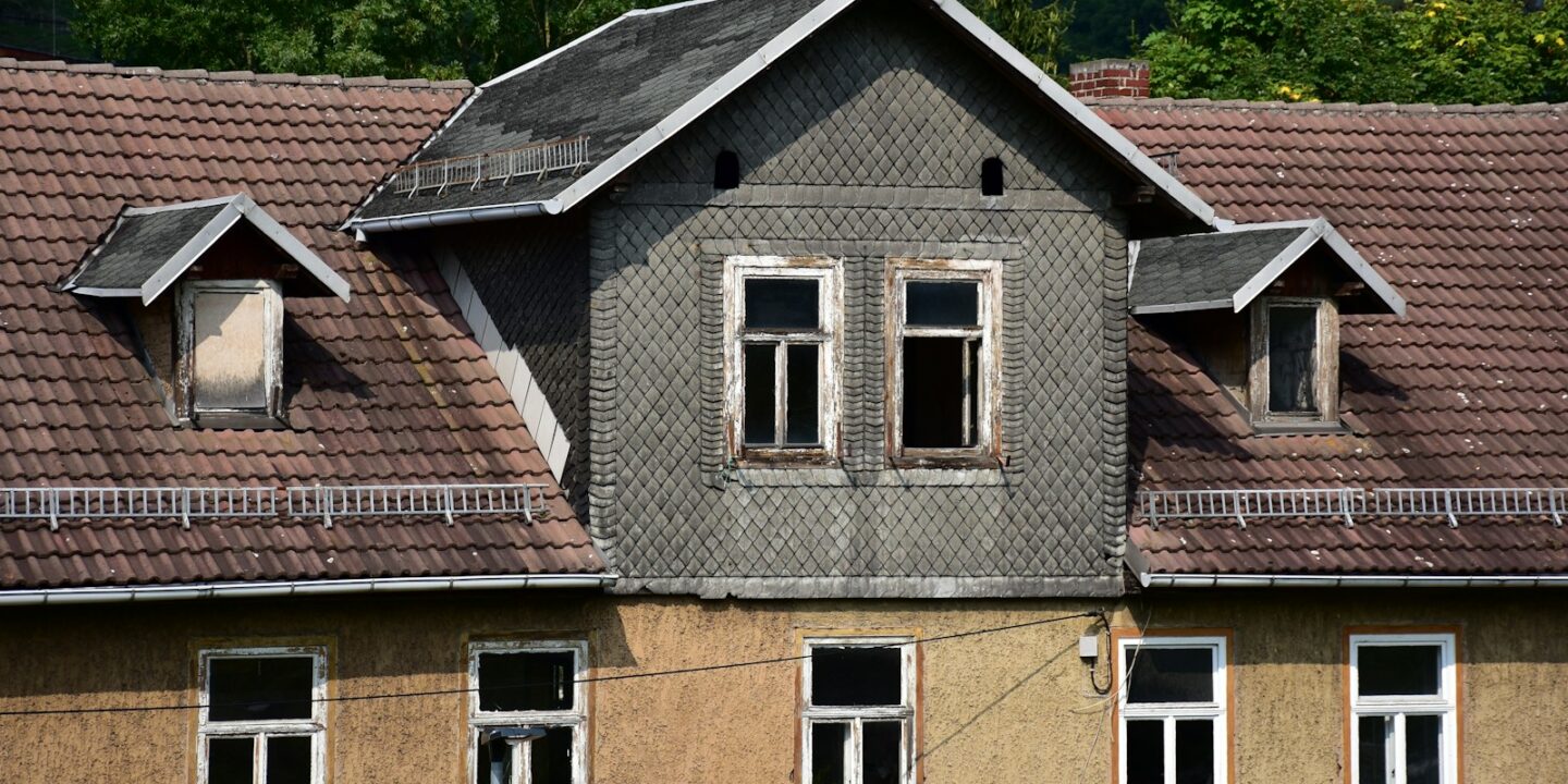 a house with a clock on the front of it