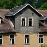 a house with a clock on the front of it