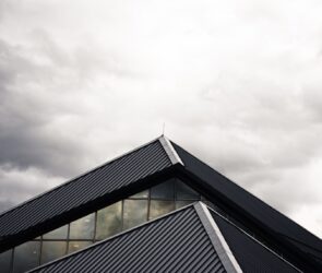 gray and black building under white clouds
